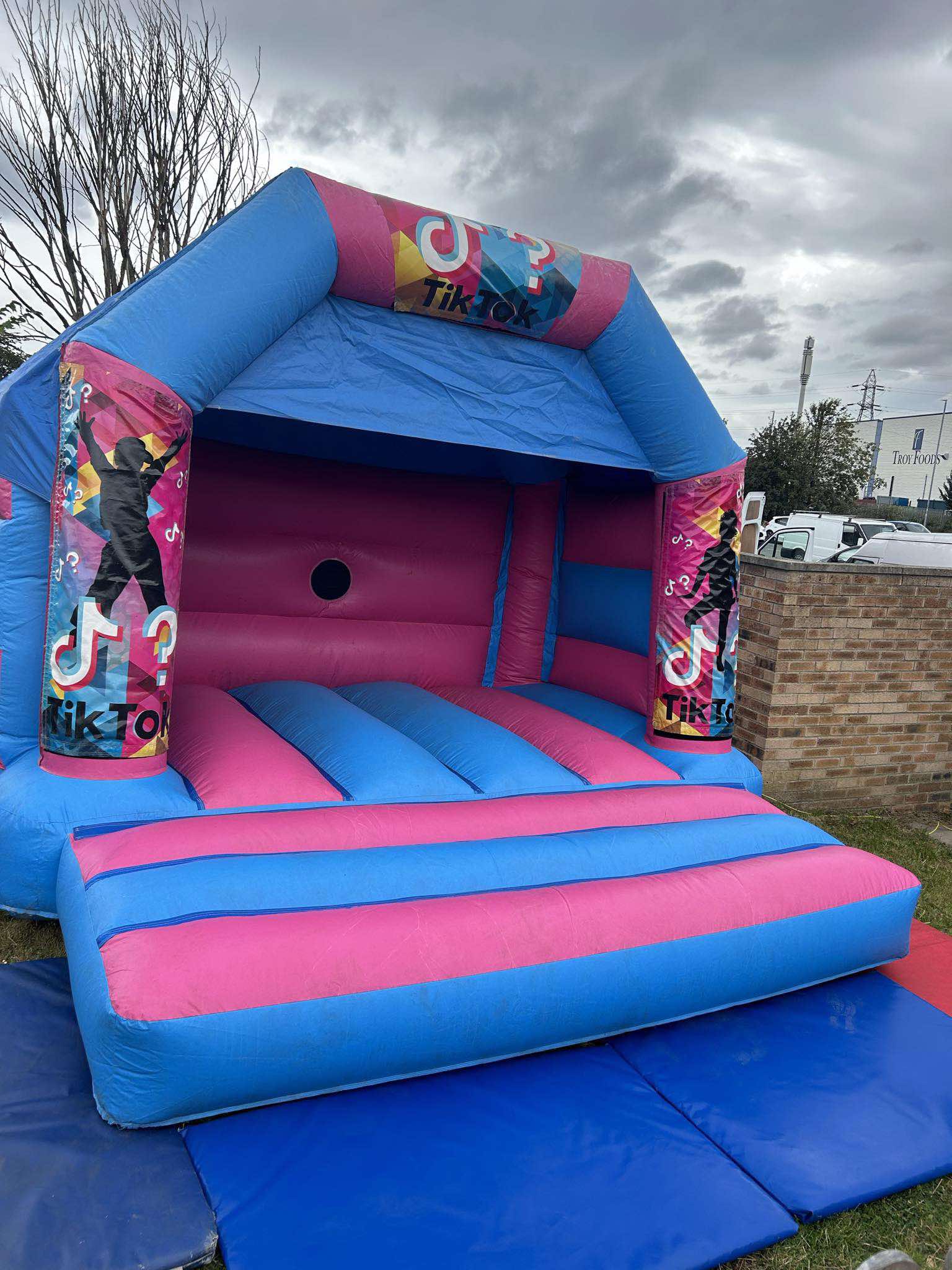 Children enjoying a colourful bouncy castle at an outdoor Yorkshire event